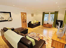 Living area with chocolate brown leather sofas 